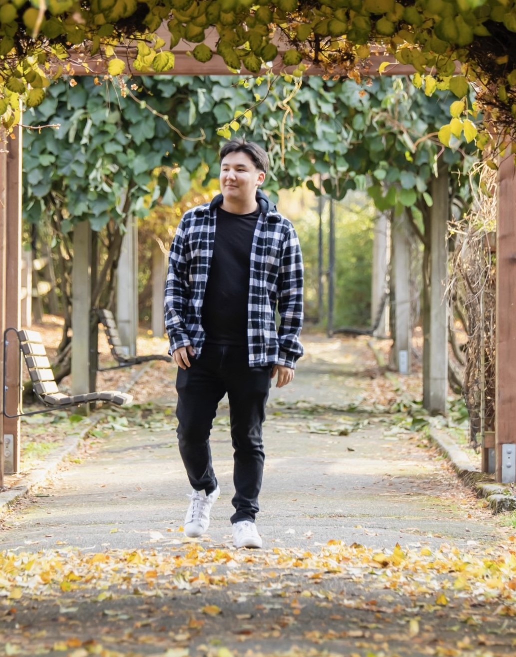 Kenji walking on road in the fall